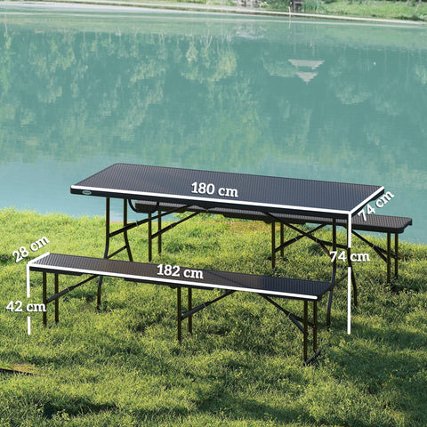 Black outsunny folding picnic table with rattan effect textured surface and matching benches 180l x 74w on grass by lake