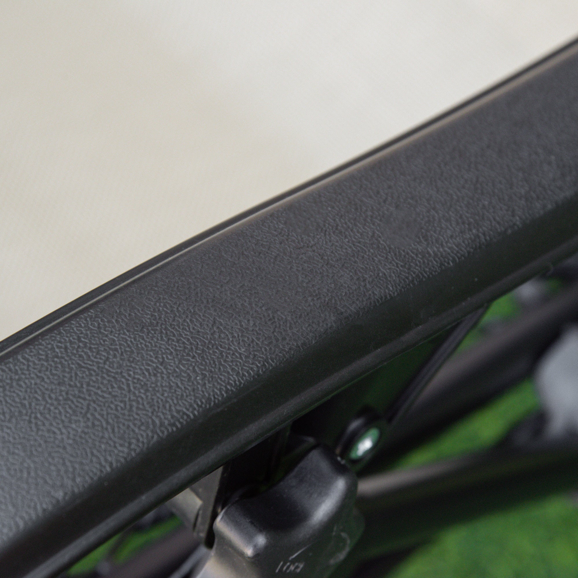 Close-up of black textured plastic frame of outsunny reclining garden chairs with breathable mesh fabric for patio use