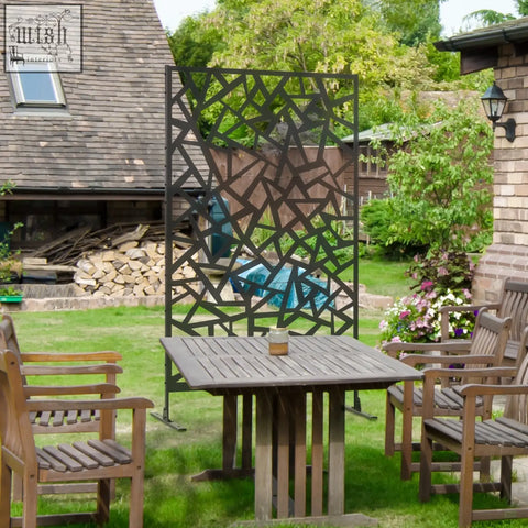 Black metal garden screen with geometric cutout pattern, two long legs, and expansion screws for privacy screen use