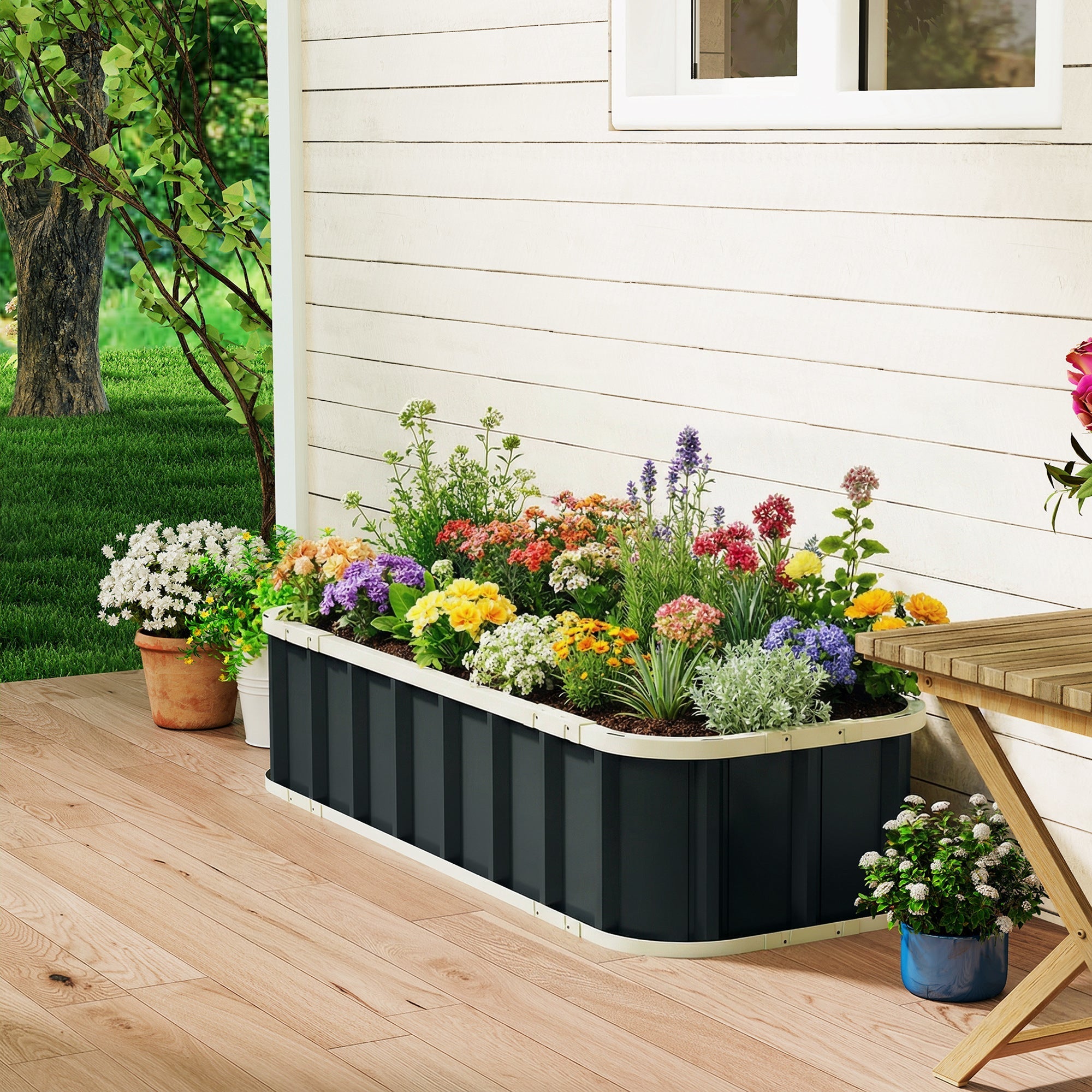 Outsunny raised garden bed in black and cream galvanized metal filled with colorful flowers for outdoor gardening