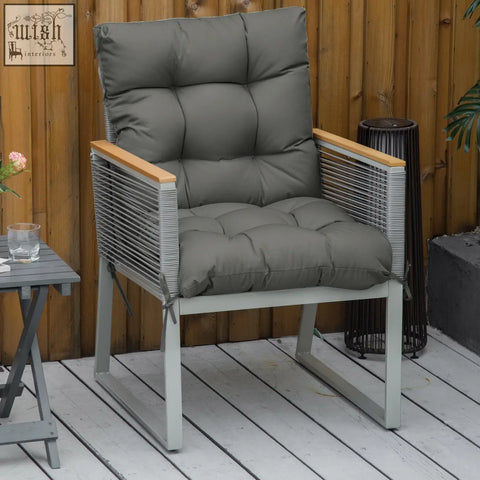 Gray cushioned outdoor armchair with woven metal frame and wooden armrests featuring a light grey seat cushion with fabric cover and tie fastenings