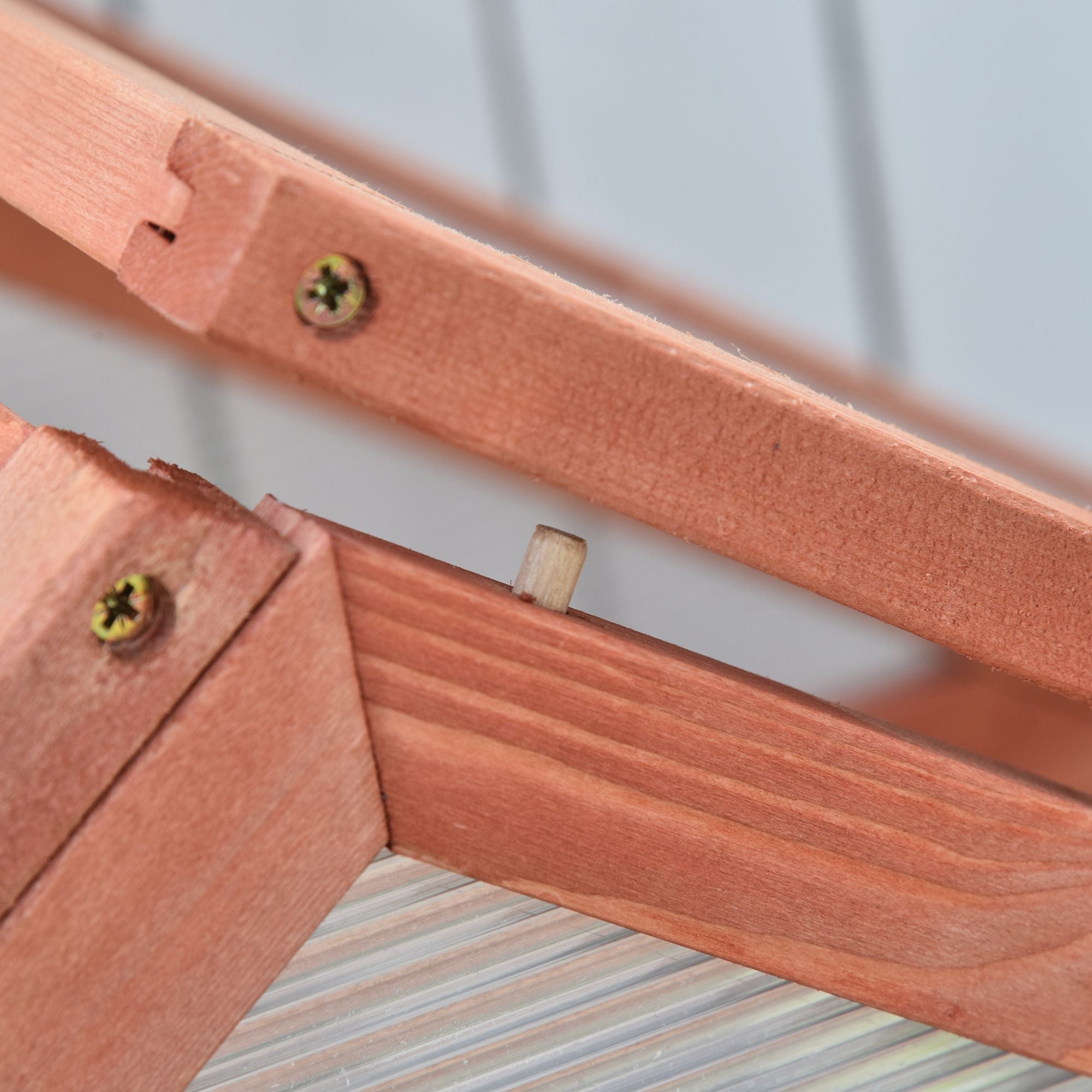 Light brown wood frame with visible grain and screws on outsunny garden cold frame with adjustable shelves