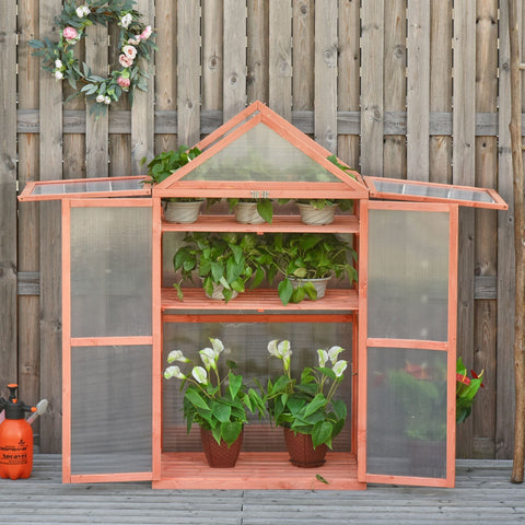 Orange wooden greenhouse with wood frame cold frame and adjustable shelves holding potted plants for growing flowers