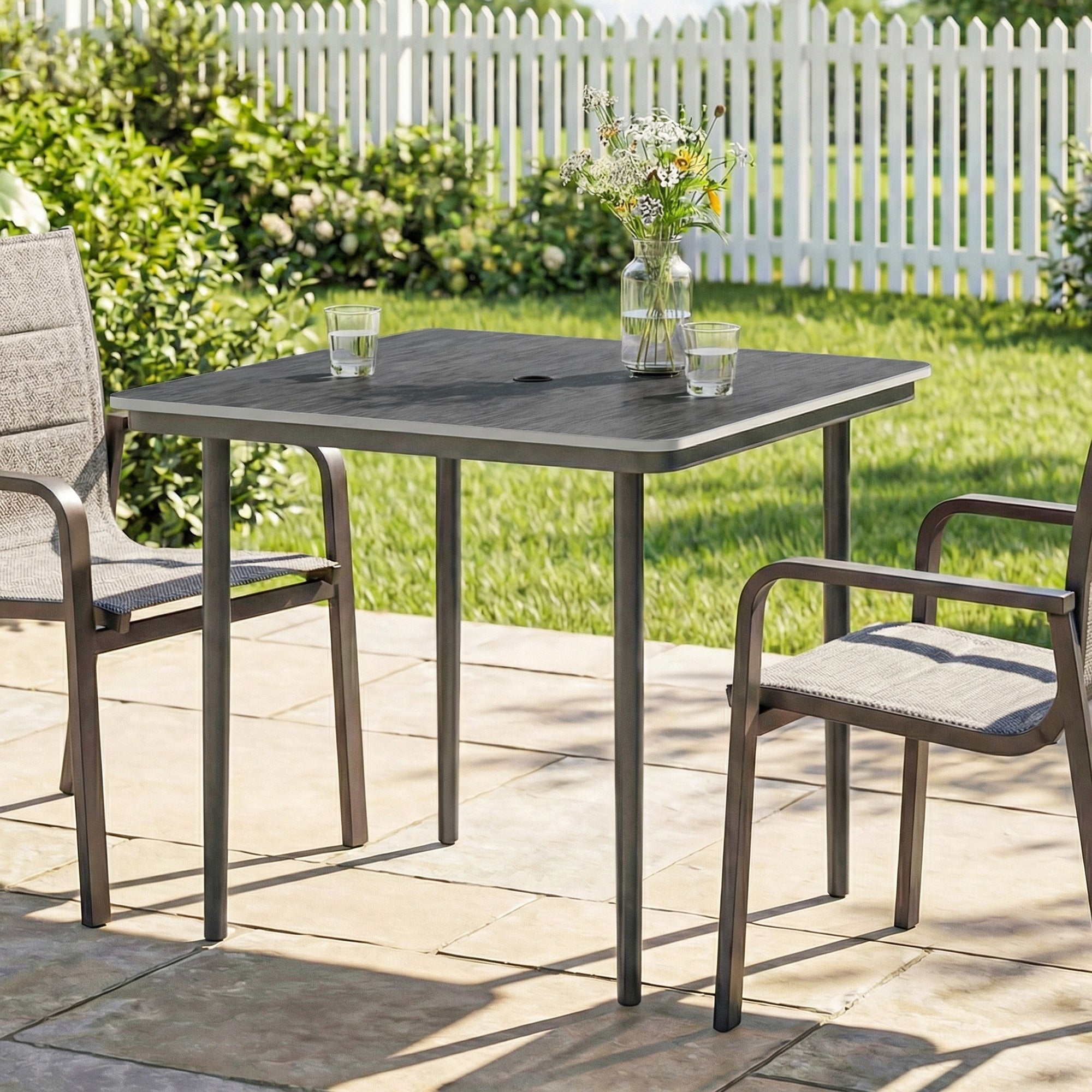Gray outsunny garden dining table for 4 with textured faux wood top metal legs and matching chairs outdoors