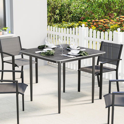Outsunny garden dining table for 4 with textured gray faux wood top and black metal legs and chairs for outdoor use