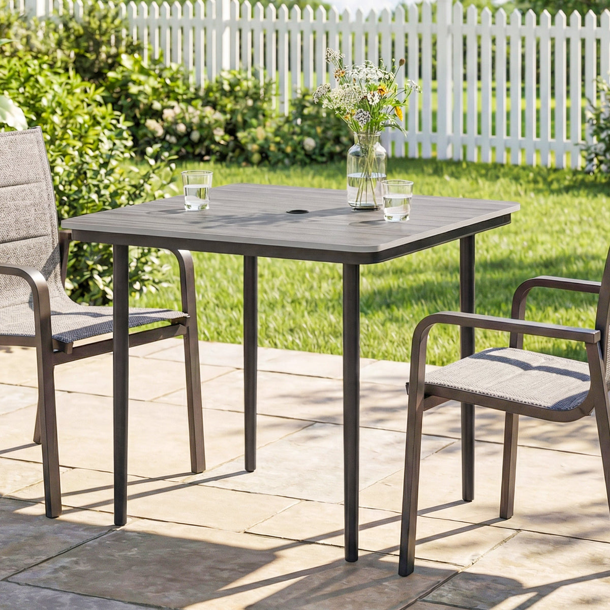 Gray outsunny garden dining table with faux wood top metal legs and umbrella hole for outdoor use