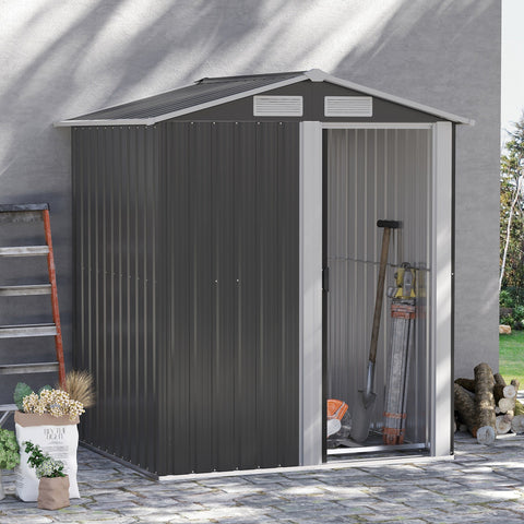 Dark gray metal garden shed with white trim, vertical siding, sliding door, sloped roof, and foundation kit for easy access inside