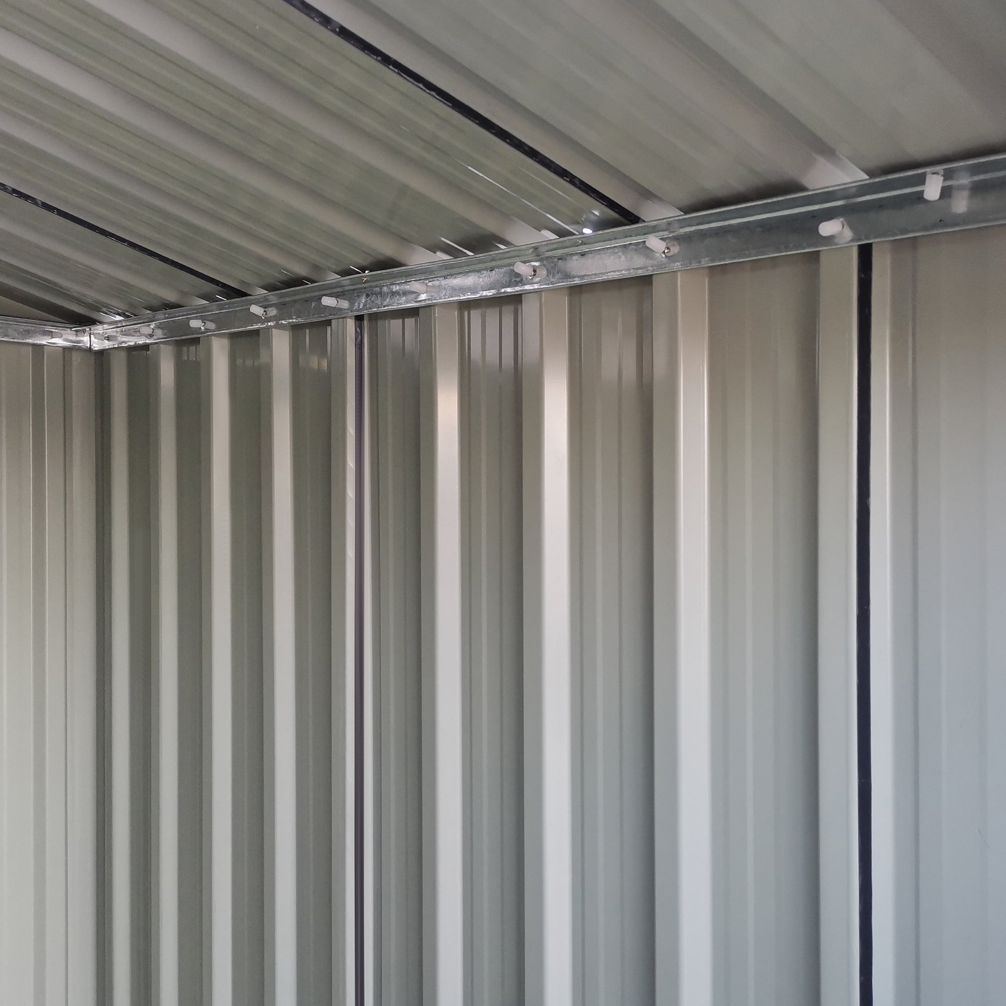 Gray outsunny garden metal tool storage shed with sliding door, foundation kit, and silver beam for easy access inside