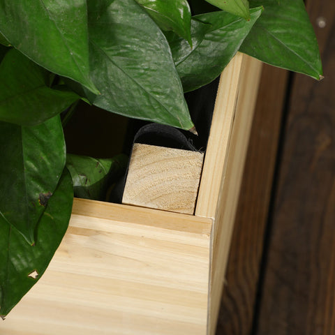 Light-colored wooden garden bed planter box with visible grain and square cutout for fabric bag or paint coating use