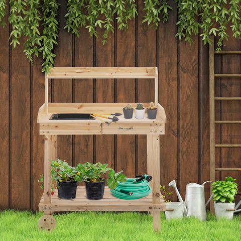 Light-colored wooden outsunny potting bench with sink basin, storage drawers, and two shelves for garden potting tasks