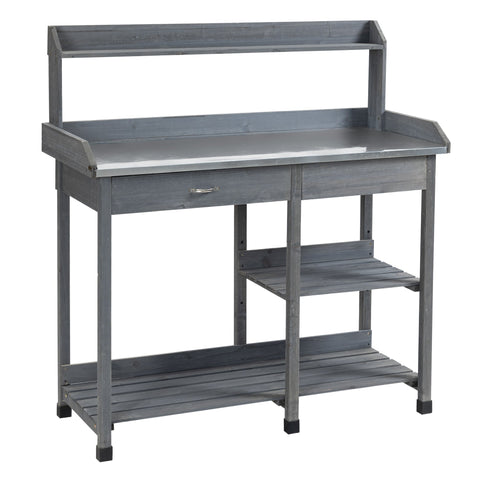 Gray wooden garden potting table with galvanized metal countertop, shelves, drawer, and hooks for outdoor use