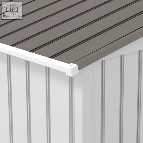 White plastic corner trim connecting gray roof to white siding on outsunny galvanised steel storage shed with foundation kit