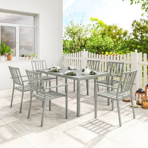 Gray galvanised steel garden table set with six stackable chairs and umbrella hole for outdoor dining
