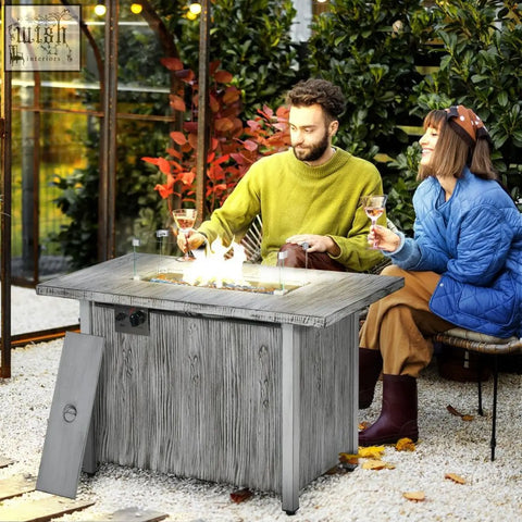 Gray weathered wood textured outsunny gas fire pit table with glass-top 50000 btu burner and side control panel