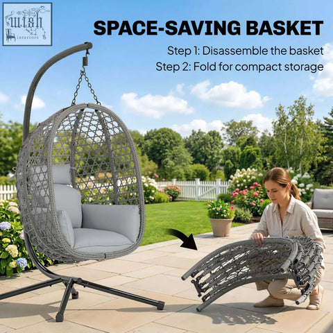 Gray woven wicker hanging egg chair with light gray cushion and safety strap for indoor outdoor use