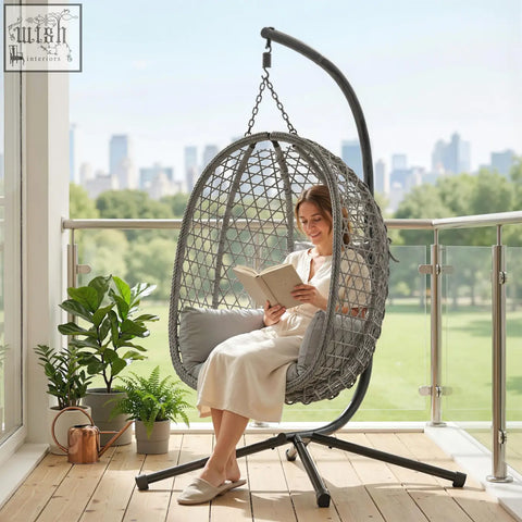 Gray woven hanging egg chair with black metal frame and safety strap by Outsunny for indoor outdoor use