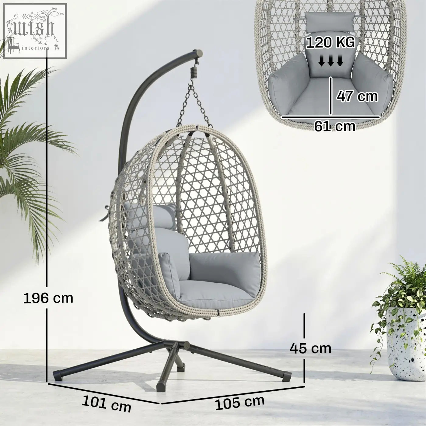 Gray woven wicker hanging egg chair with plush cushion and black metal stand featuring safety strap and foldable basket