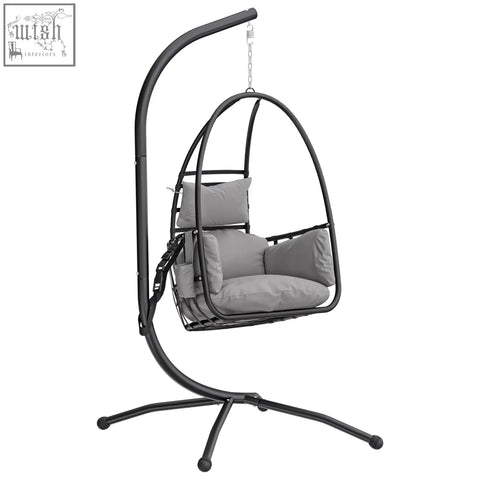 Black metal hanging egg chair with gray cushions featuring a powder-coated steel frame and safety strap for secure swinging