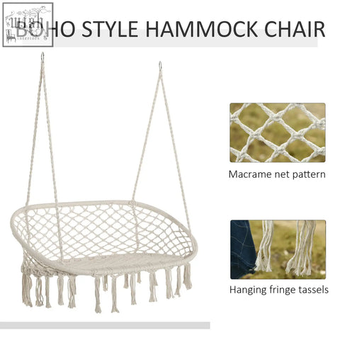 Cream-colored hanging hammock chair with metal frame macrame net pattern and fringe tassels for indoor or outdoor use