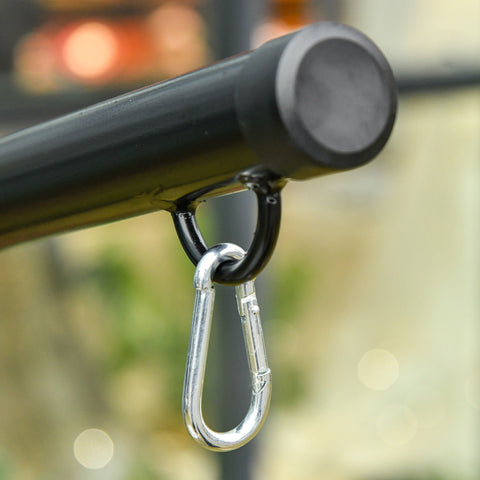 Silver spring buckle carabiner hanging from black powder coated steel hammock chair stand pole for indoor outdoor use