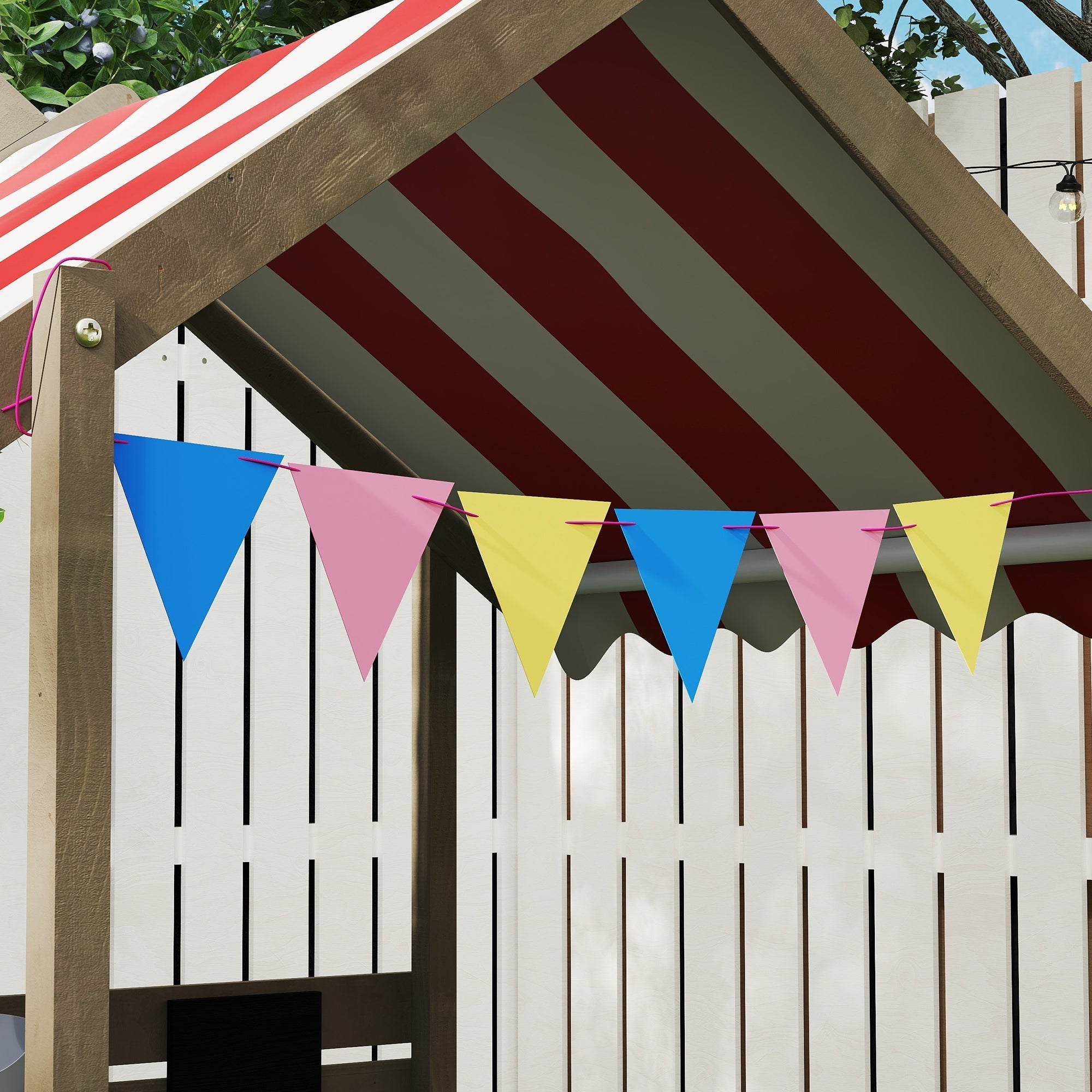 Colorful triangular bunting with blue pink and yellow flags on outsunny fir wood sandbox with bottomless design gray