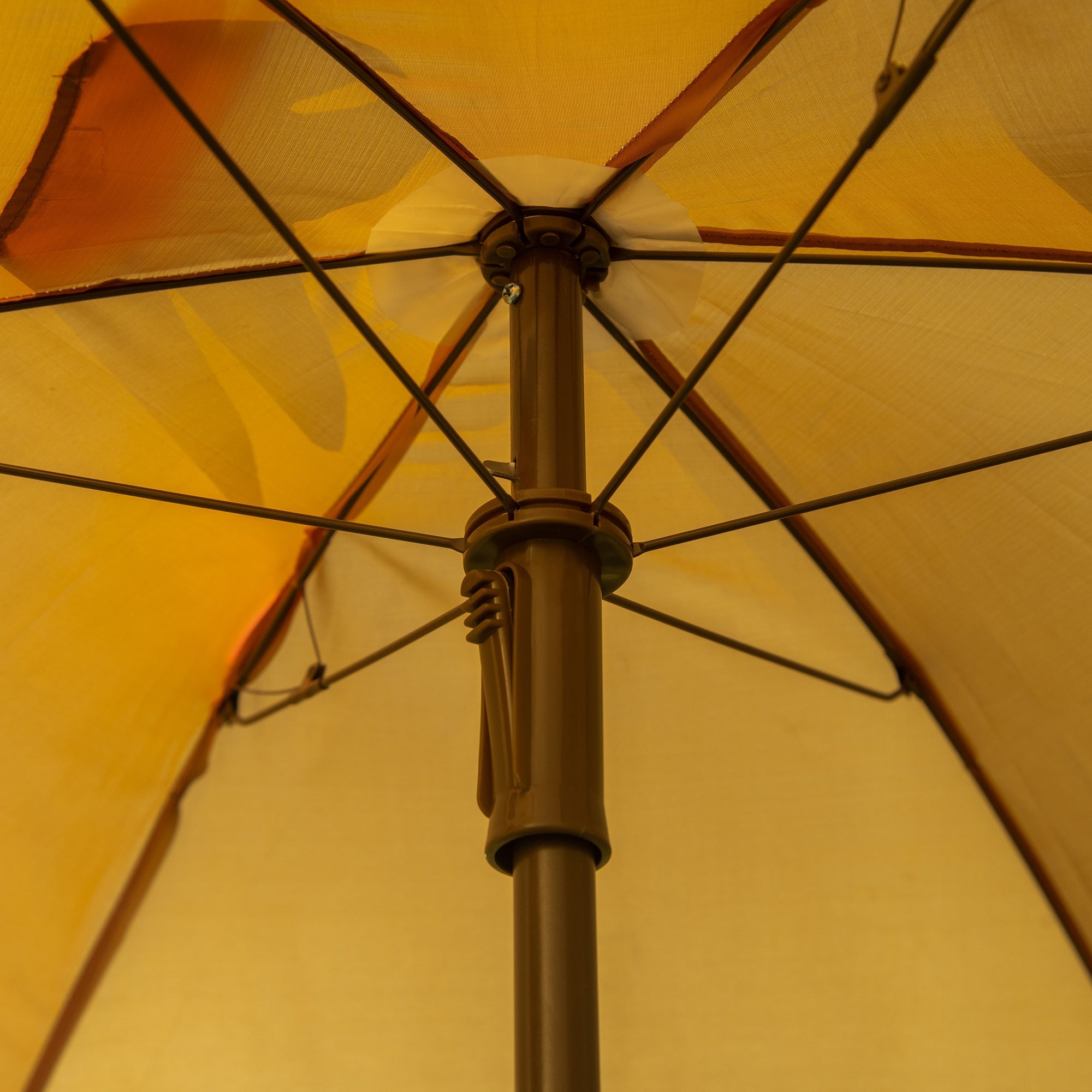 A warm yellow sun umbrella with a sturdy brown metal pole and monkey design in outsunny kids bistro set