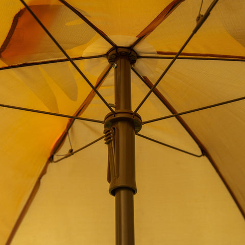 A warm yellow sun umbrella with a sturdy brown metal pole and monkey design in outsunny kids bistro set