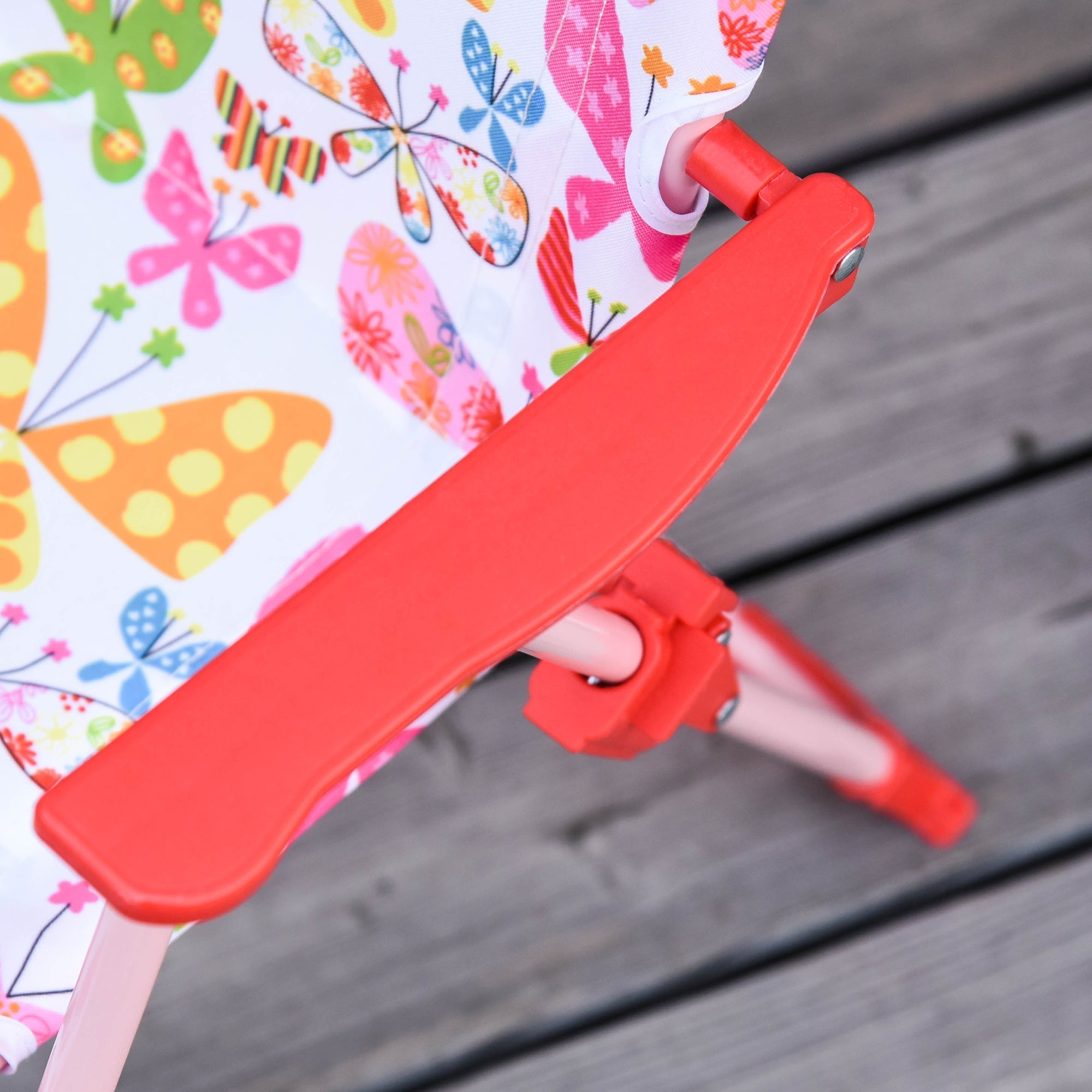 A vibrant red plastic folding chair with butterfly pattern fabric seat from outsunny kids outdoor bistro set with chair dimension details