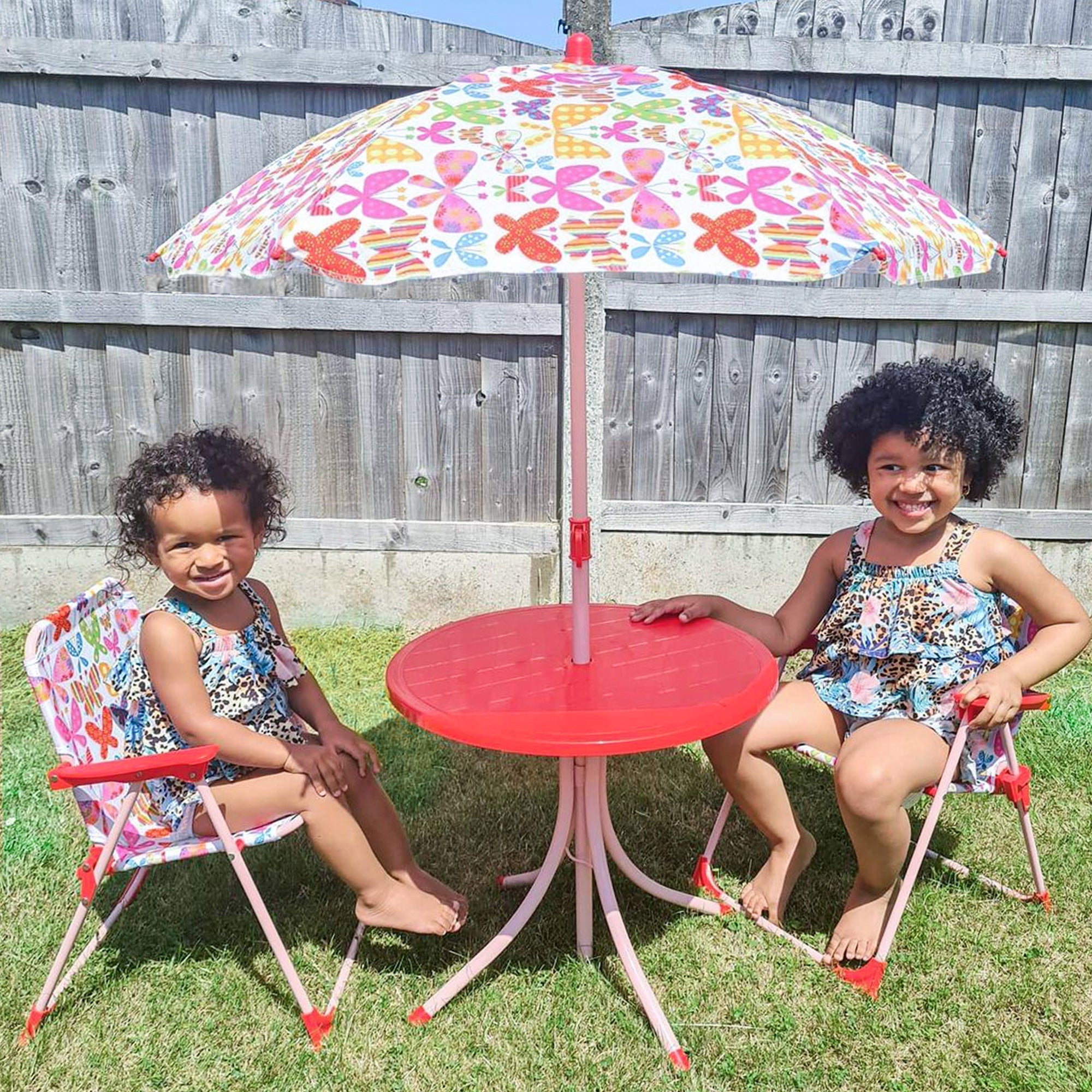 Red plastic patio table with pink metal legs and butterfly pattern umbrella in outsunny kids outdoor bistro set chair dimension included