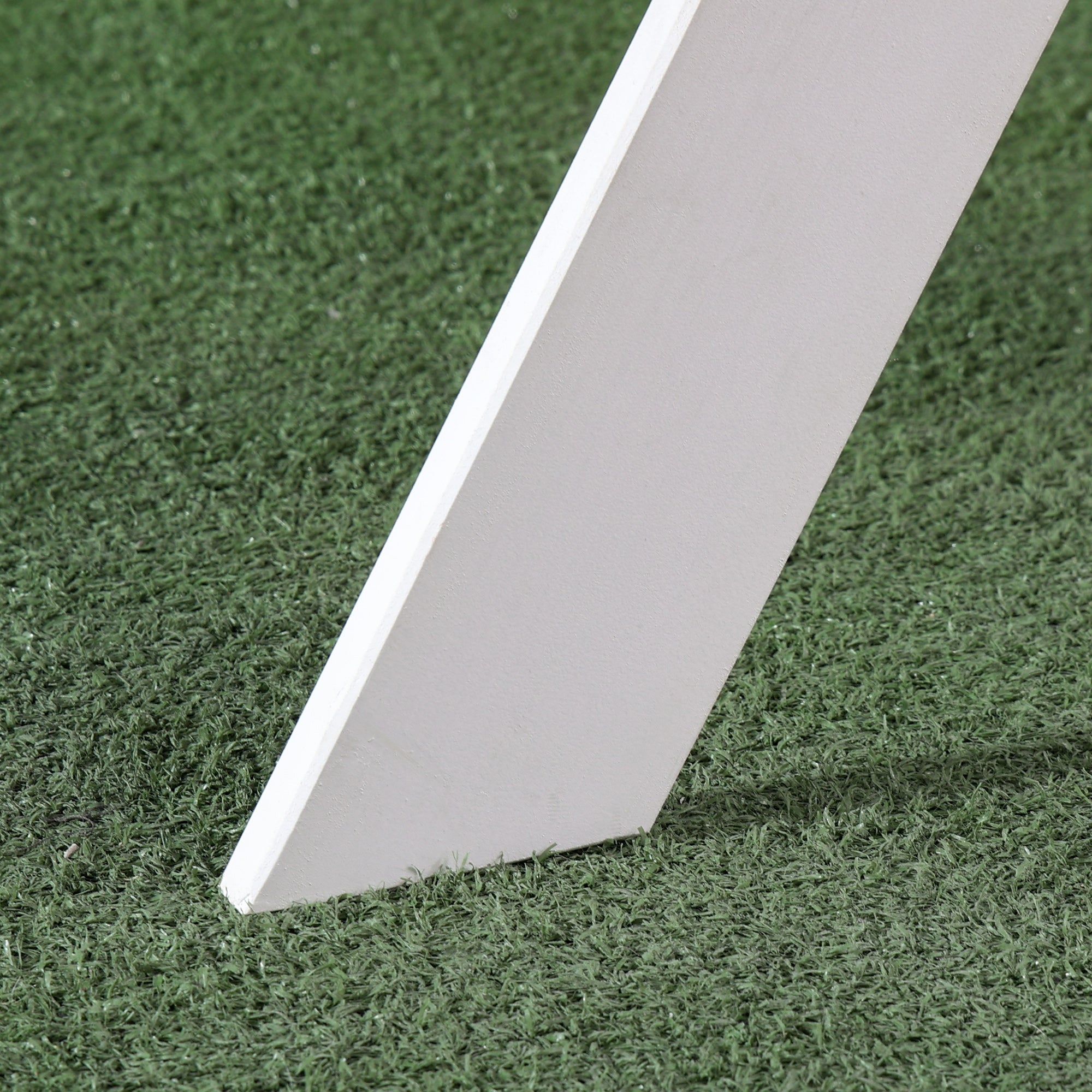 A sleek white plastic table leg with smooth finish on outsunny kids picnic table for easy assembly and strong load-bearing frame