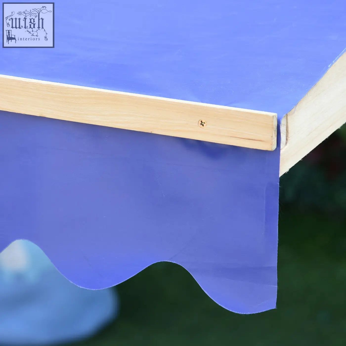 Blue fabric awning with light wood frame on fir wood wooden sand pit for outdoor kids play station sandbox