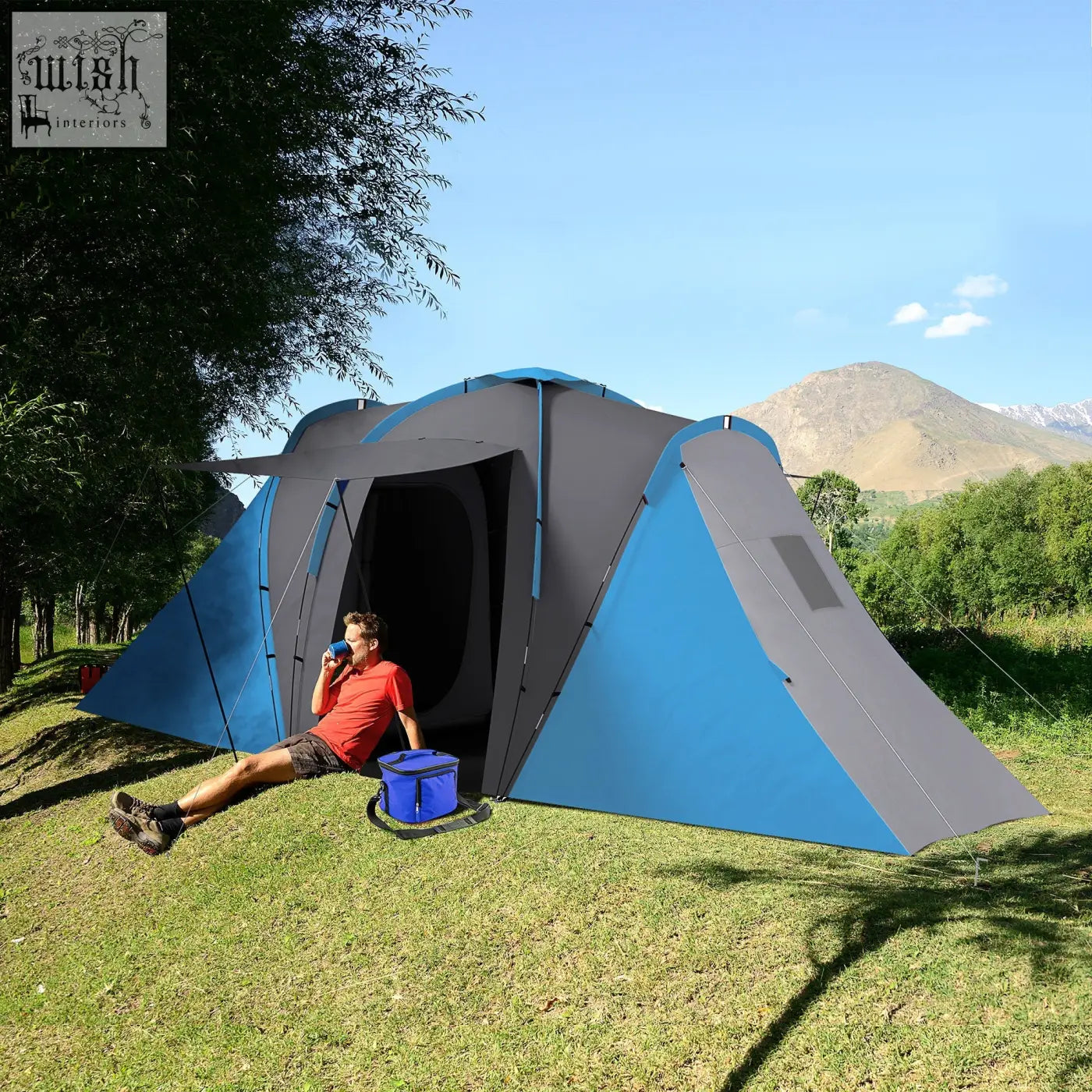 Blue and gray outsunny large camping tent with two bedrooms and carry bag included set up on grass near trees