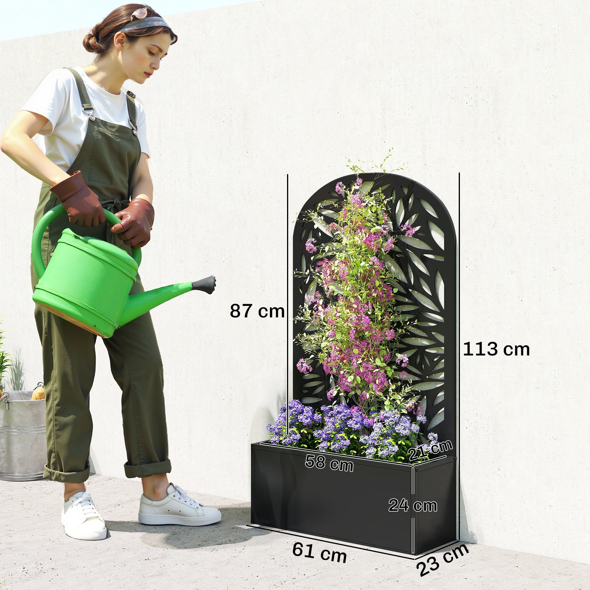 Black powder coated metal outsunny garden bed with leaf cut-out trellis filled with purple and pink flowers