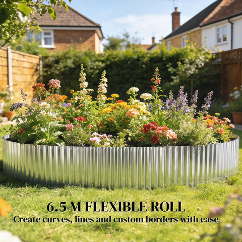 Silver galvanised steel lawn edging roll 6.5 meters long encircling vibrant flower bed as metal garden edging