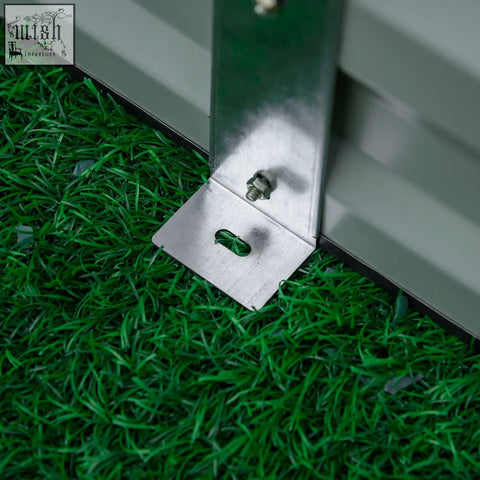 Silver metal l-shaped bracket with bolt and green fastener securing gray panel on outsunny raised garden bed
