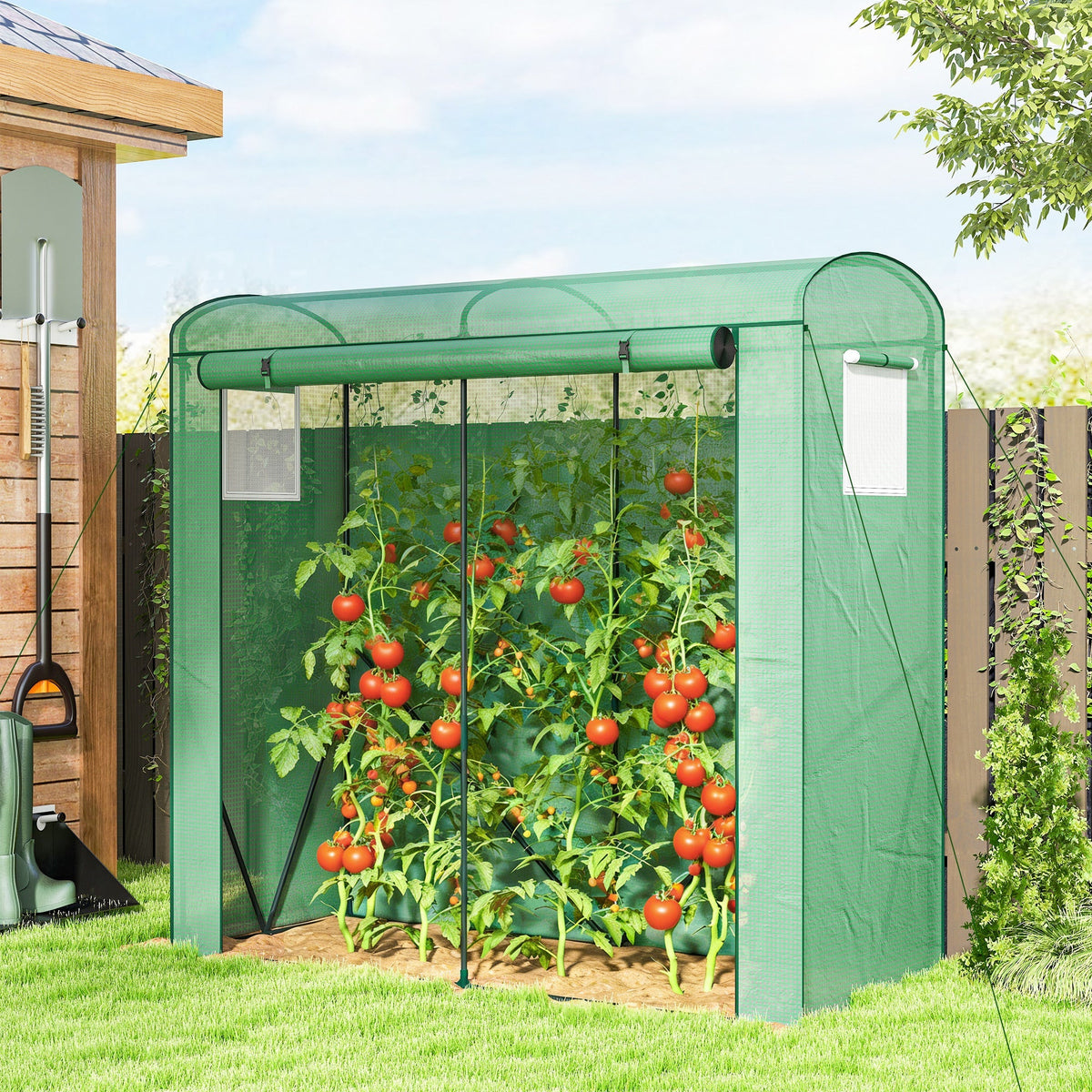 Green fabric Outsunny mini greenhouse with steel frame, mesh windows, and PE cover protecting tomato plants from unwanted guests