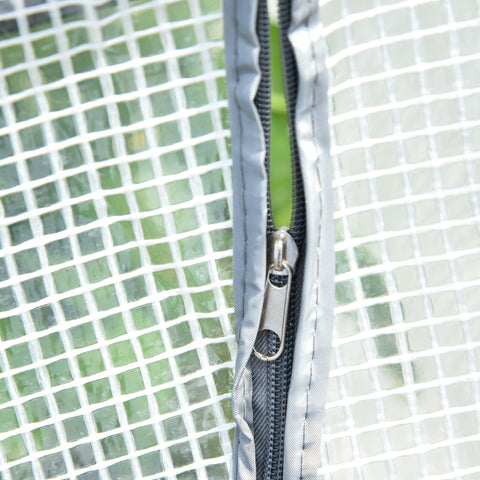Gray zipper with metallic pull tab on white mesh plastic cover of outsunny mini greenhouse for garden use