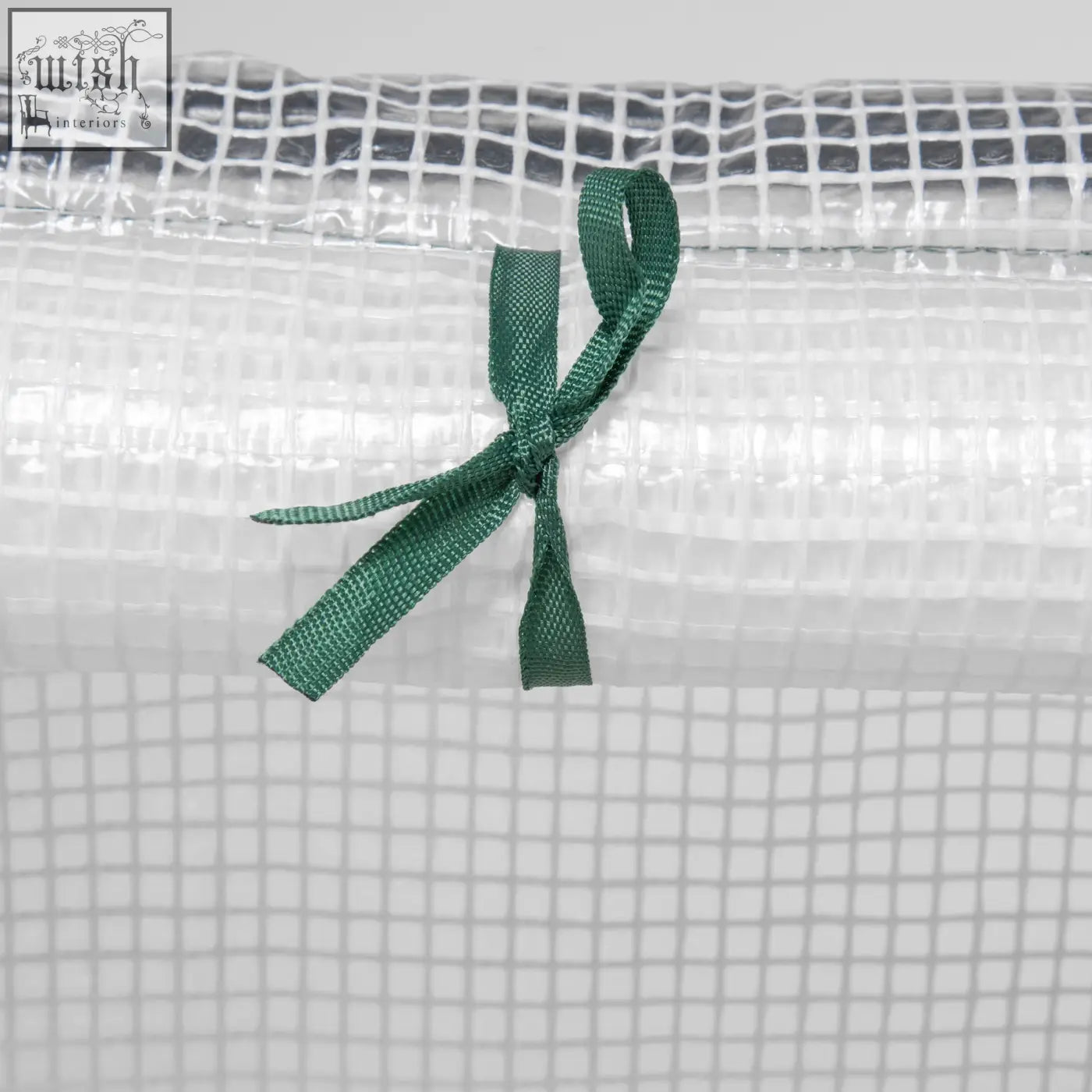 Outsunny mini greenhouse with white plastic mesh cover tied with green ribbon for plants and vegetables
