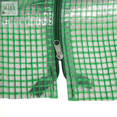 Green mesh cover with silver zipper on outsunny mini greenhouse featuring plastic mesh cover for plants and vegetables