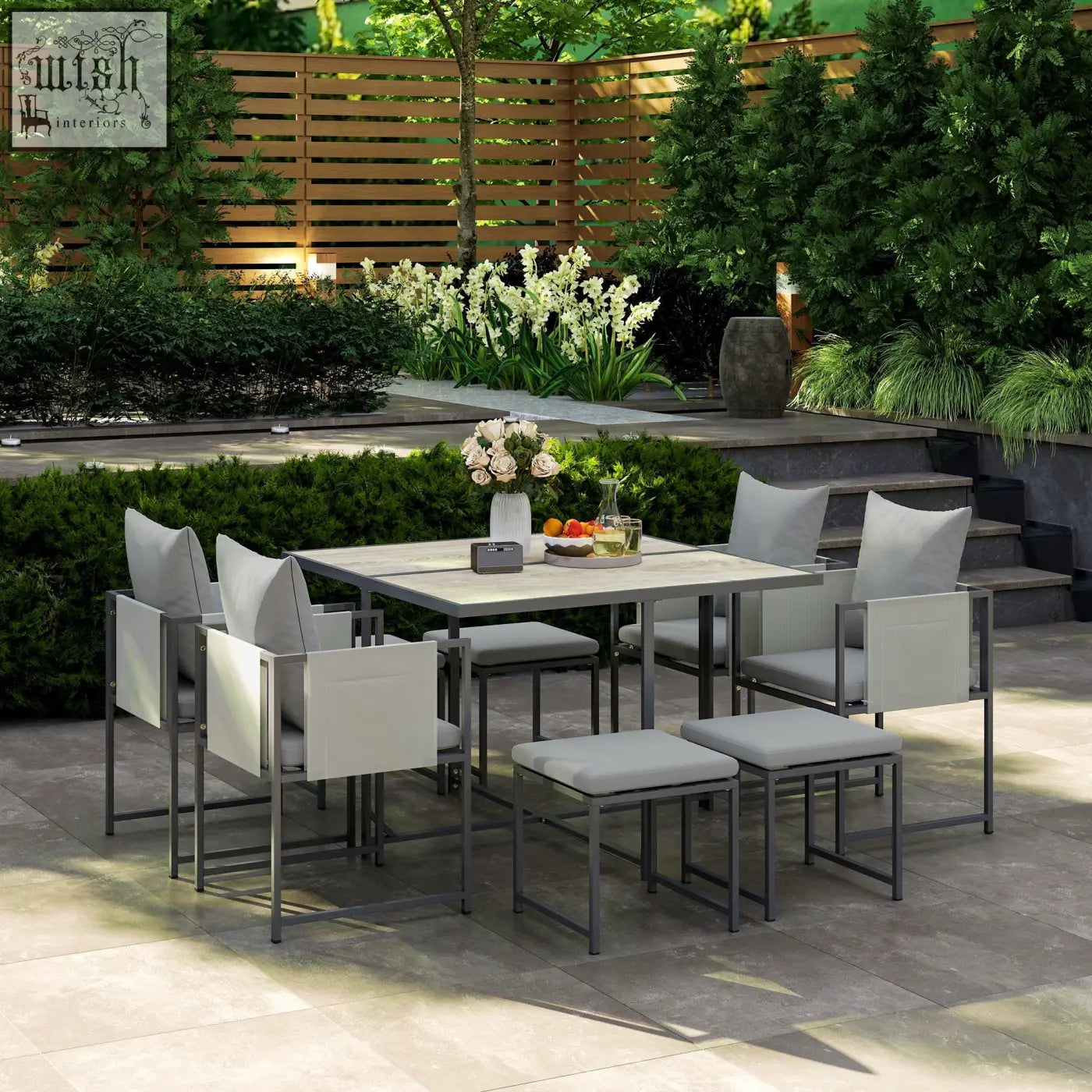 Modern outdoors nine-piece dining set with powder coated steel frames gray metal and light beige fabric cushions