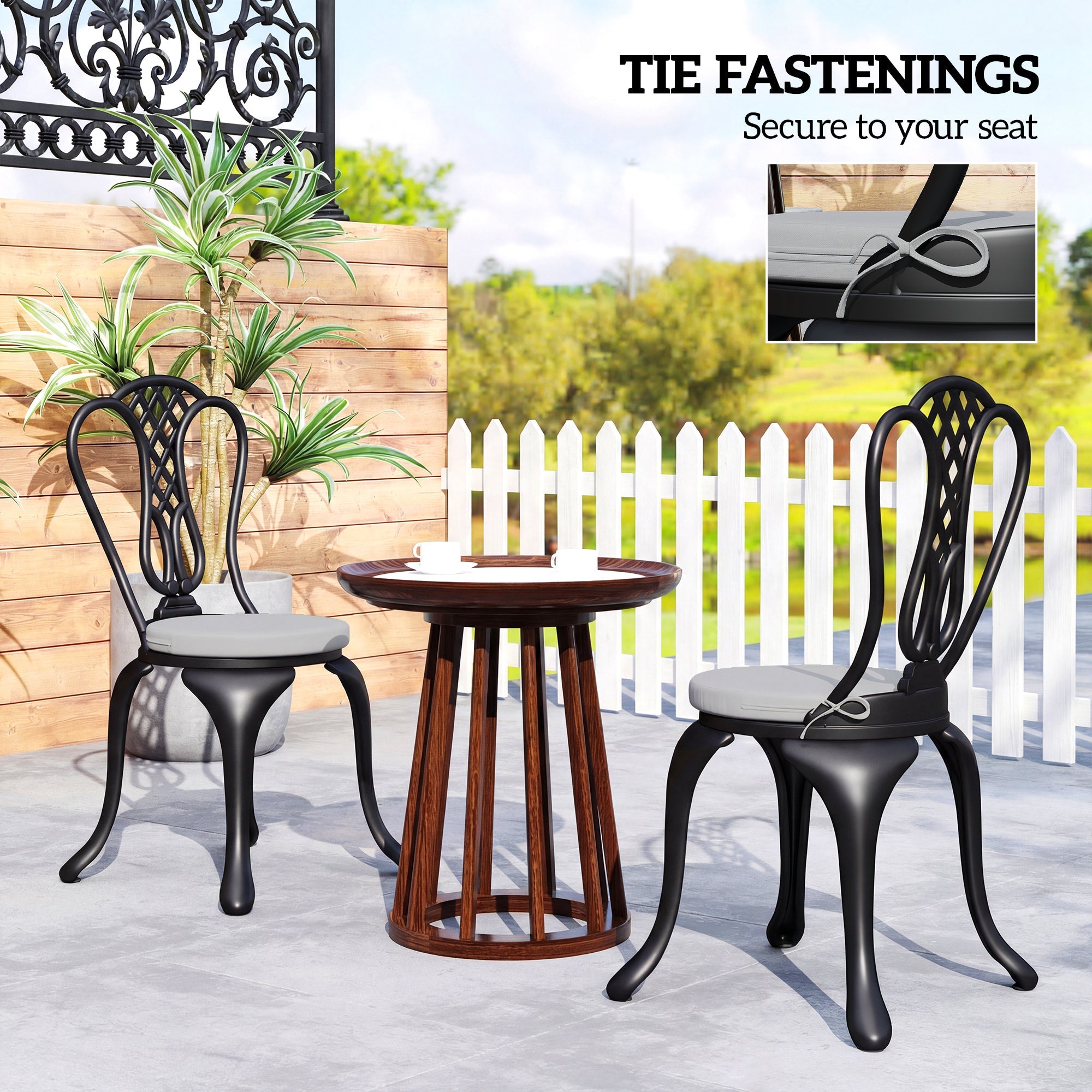 Black wrought iron patio chairs with light grey outsunny outdoor seat cushions and removable covers for comfort