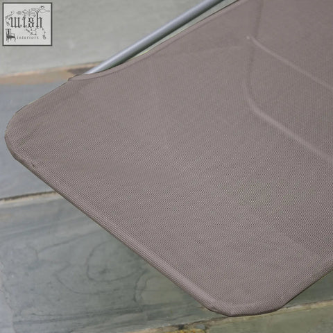 The taupe mesh fabric seat of the outsunny foldable sun lounger with steel frames and adjustable backrest