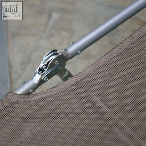 Silver metal joint connecting gray pole to brown mesh fabric on outsunny foldable sun lounger with steel frames