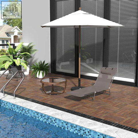 White patio umbrella with wooden pole beside a foldable sun lounger with steel frames near the pool