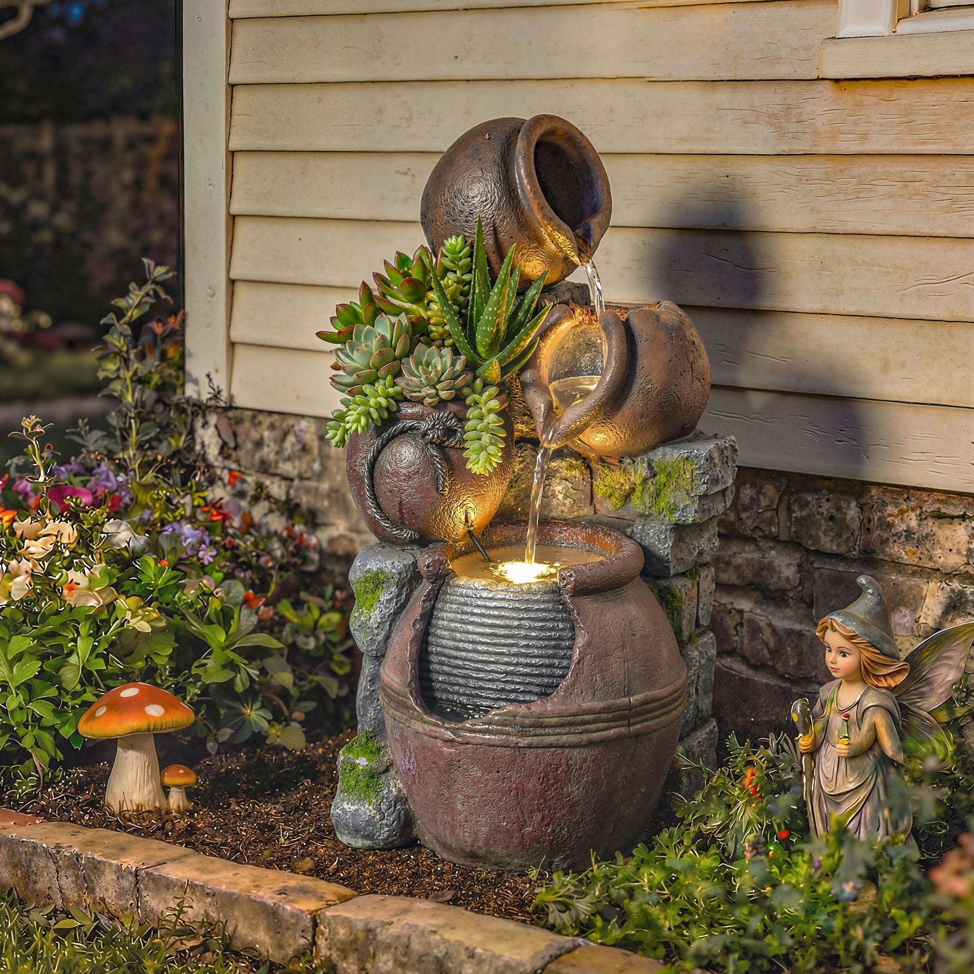 Rustic brown outsunny outdoor waterfall fountain with stacked terracotta pots, succulents, and warm led lights