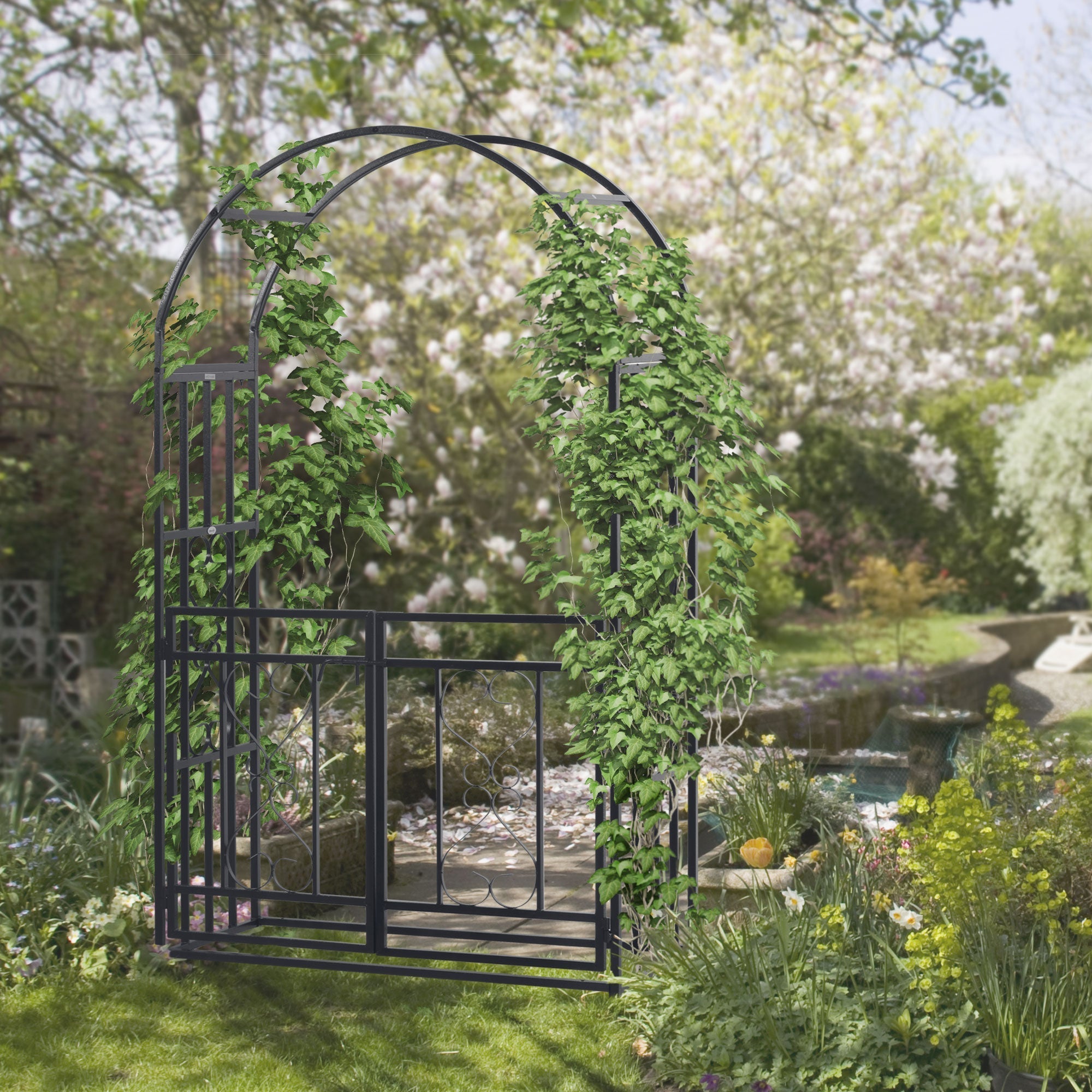 Dark grey metal garden arbor with lush green ivy climbing plants on curved frame and double gates for outdoor use