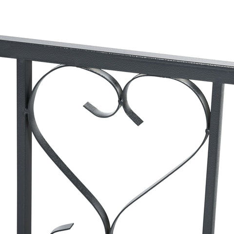 Dark grey wrought iron garden arbor with heart-shaped railing detail perfect for climbing plants and outdoor use