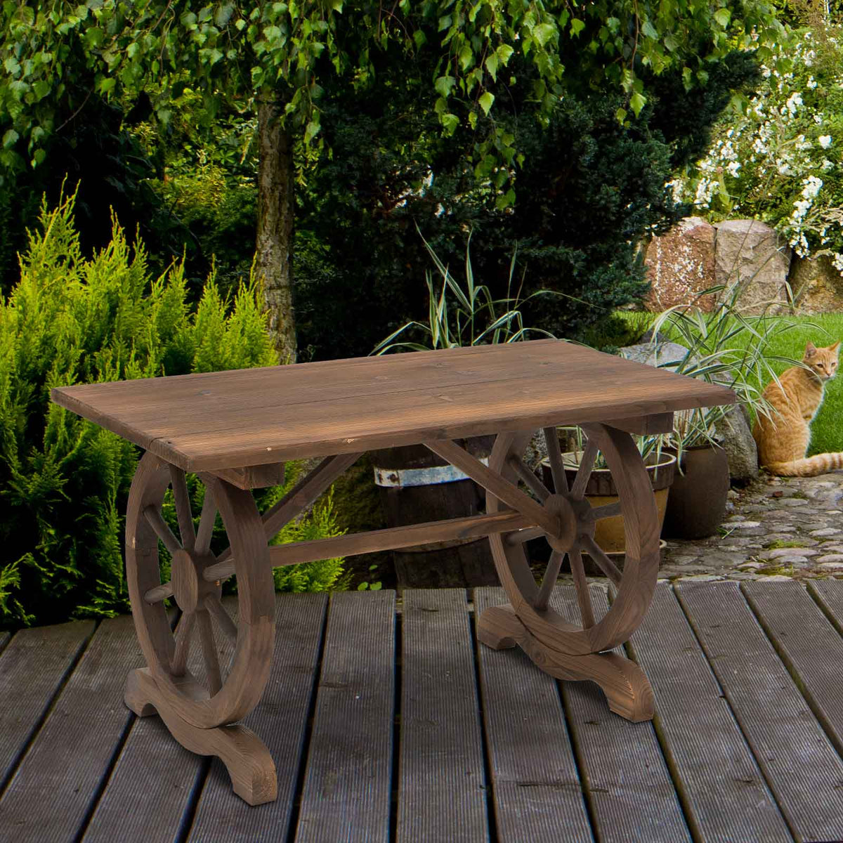 Rustic brown outdoor garden coffee table with wagon wheel legs made of natural carbonized fir wood color