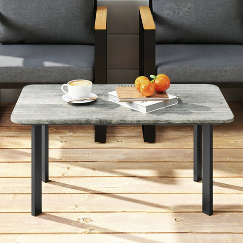 Gray stone-top outdoor coffee table with black metal legs featuring a slatted wood plastic composite top by Outsunny