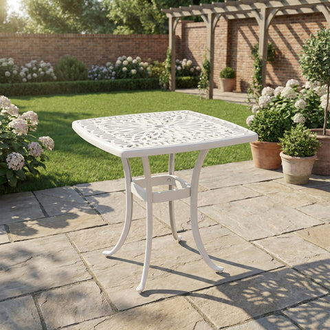 White cast aluminium garden table with floral cut-out design and umbrella hole 54l x 54wcm for outdoor use